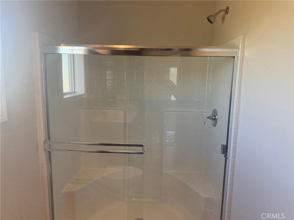14450 Meridian Road Chico, CA 95973 - Photo 7 of 37 a bathroom with a glass shower door