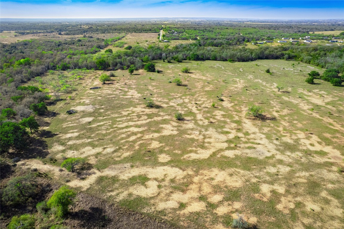 1180 Bugtussle Lane Luling, TX 78648 - Photo 4 of 19 a view of a field with an ocean view