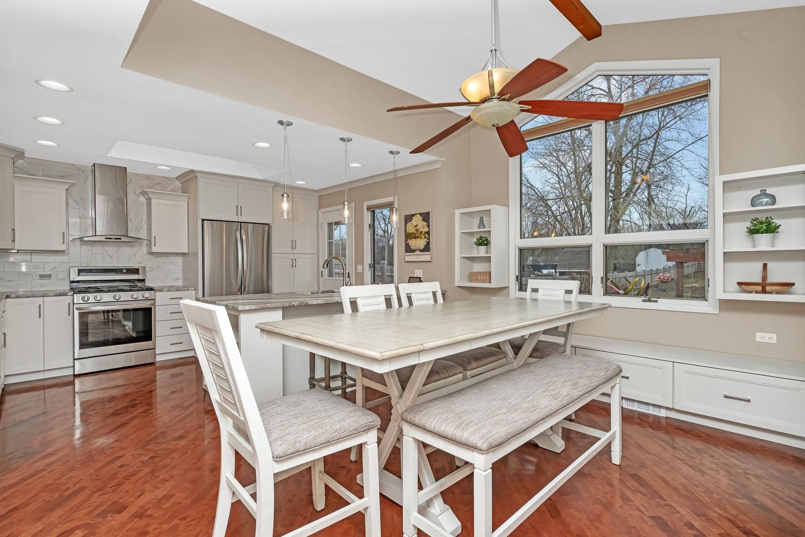 11600 North Brightway Road Mokena, IL 60448 - Photo 4 of 62 a kitchen with a stove a refrigerator and a dining table