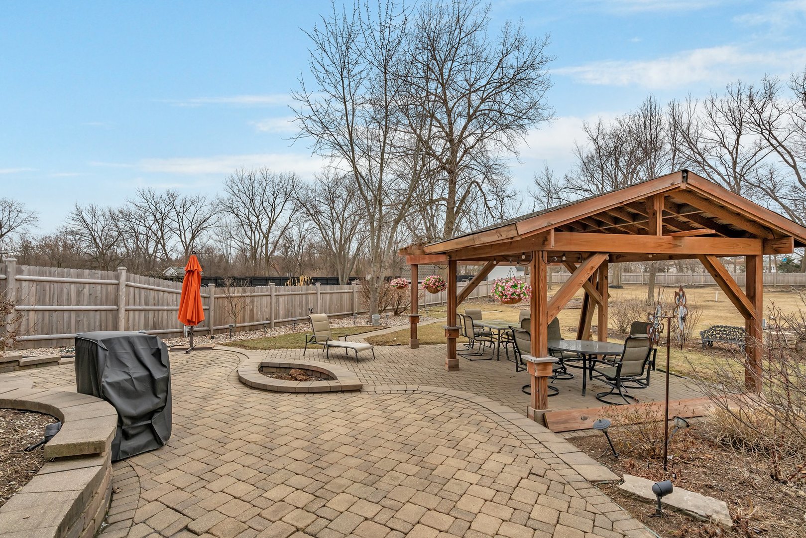 11600 North Brightway Road Mokena, IL 60448 - Photo 52 of 62 a view of a roof deck with table and chairs under an umbrella