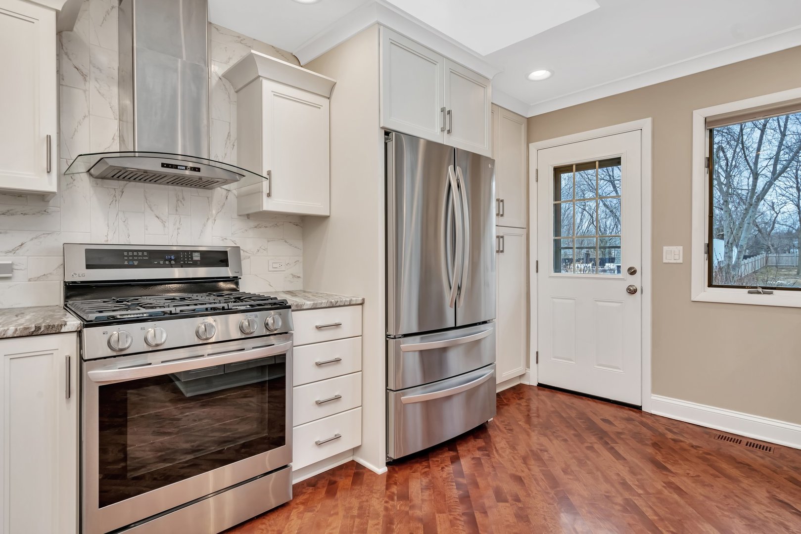 11600 North Brightway Road Mokena, IL 60448 - Photo 7 of 62 a kitchen with stainless steel appliances a stove a refrigerator and cabinets