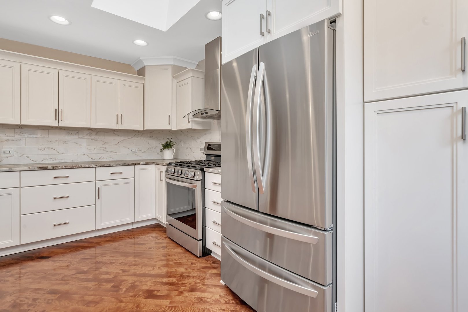 11600 North Brightway Road Mokena, IL 60448 - Photo 8 of 62 a kitchen with white cabinets and white appliances