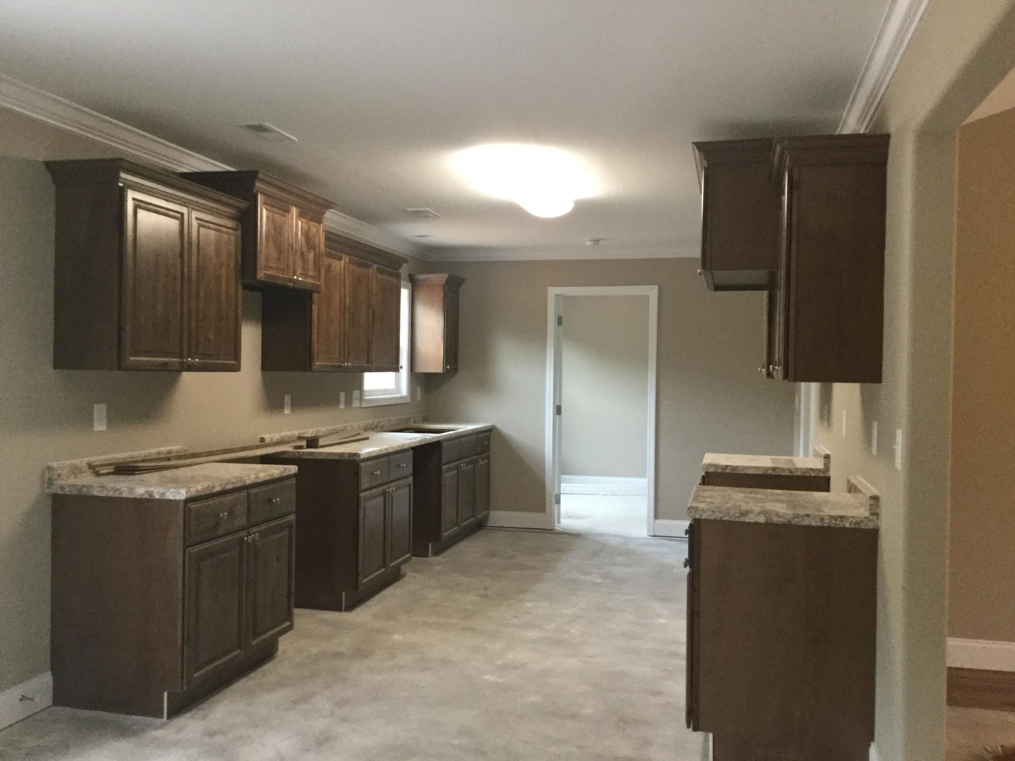 4432 Morganton Road Maryville, TN 37801 - Photo 3 of 8 a modern kitchen with stainless steel appliances granite countertop a stove a sink and a refrigerator
