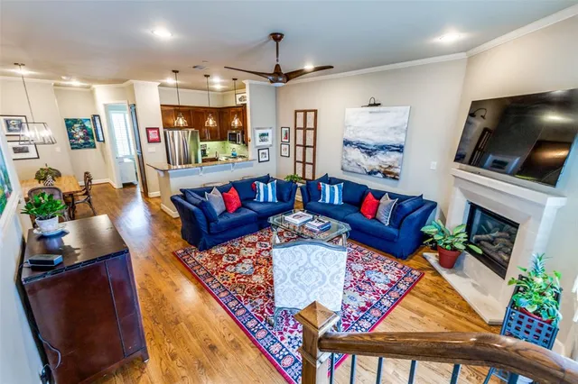 a living room with furniture fireplace and flat screen tv