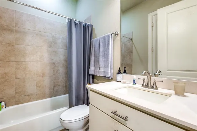 a bathroom with a sink a toilet and a bathtub