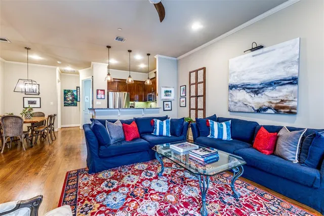a living room with furniture and a rug