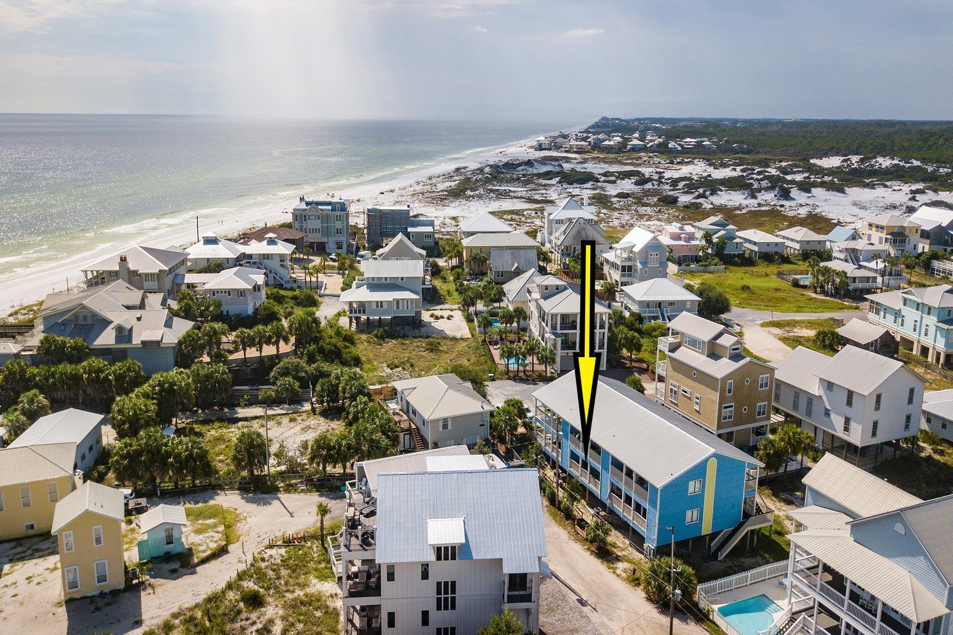 63 Sandy Lane, Unit 102 Santa Rosa Beach, FL 32459 - Photo 1 of 26 an aerial view of a building with parking