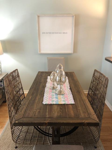 63 Sandy Lane, Unit 102 Santa Rosa Beach, FL 32459 - Photo 11 of 26 a view of a dining room with furniture and a window