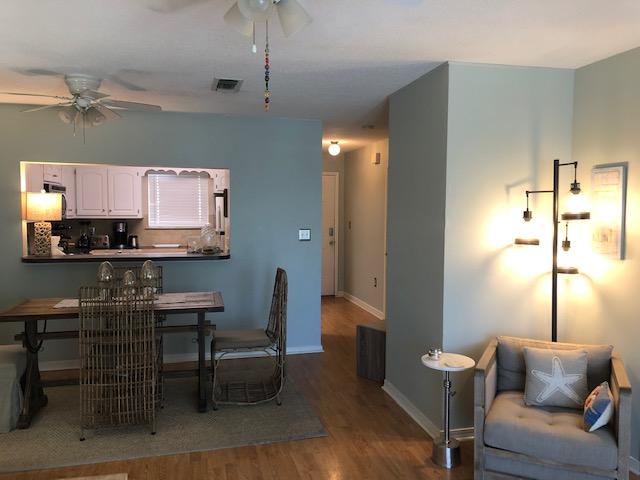 63 Sandy Lane, Unit 102 Santa Rosa Beach, FL 32459 - Photo 12 of 26 a living room with furniture and a wooden floor