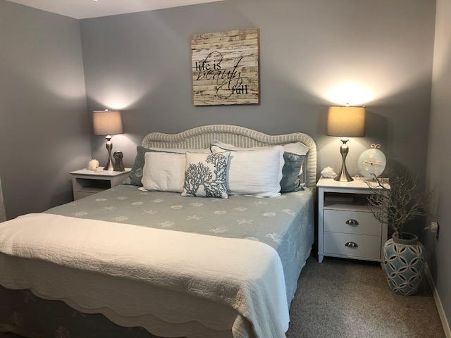 63 Sandy Lane, Unit 102 Santa Rosa Beach, FL 32459 - Photo 17 of 26 a bedroom with a bed and a lamp