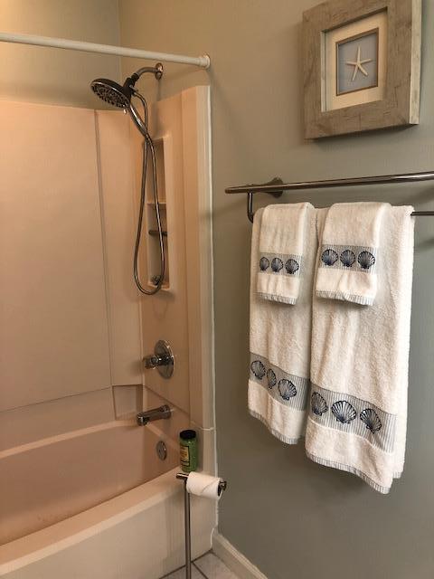 63 Sandy Lane, Unit 102 Santa Rosa Beach, FL 32459 - Photo 19 of 26 a bathroom with a tub and shower
