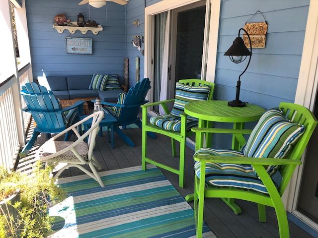 63 Sandy Lane, Unit 102 Santa Rosa Beach, FL 32459 - Photo 20 of 26 a view of an chairs and tables in the balcony