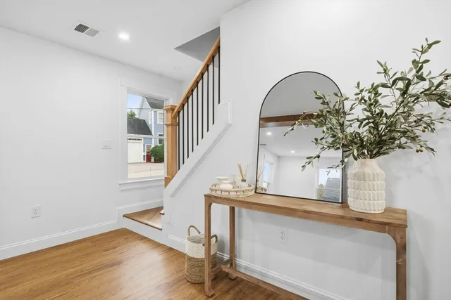 a view of entryway with wooden floor