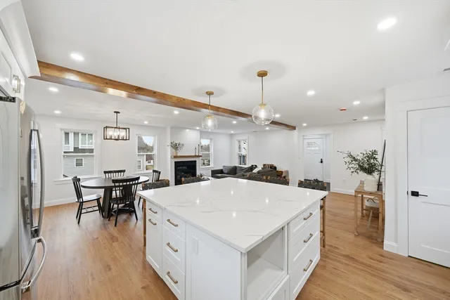a large kitchen with a table and chairs