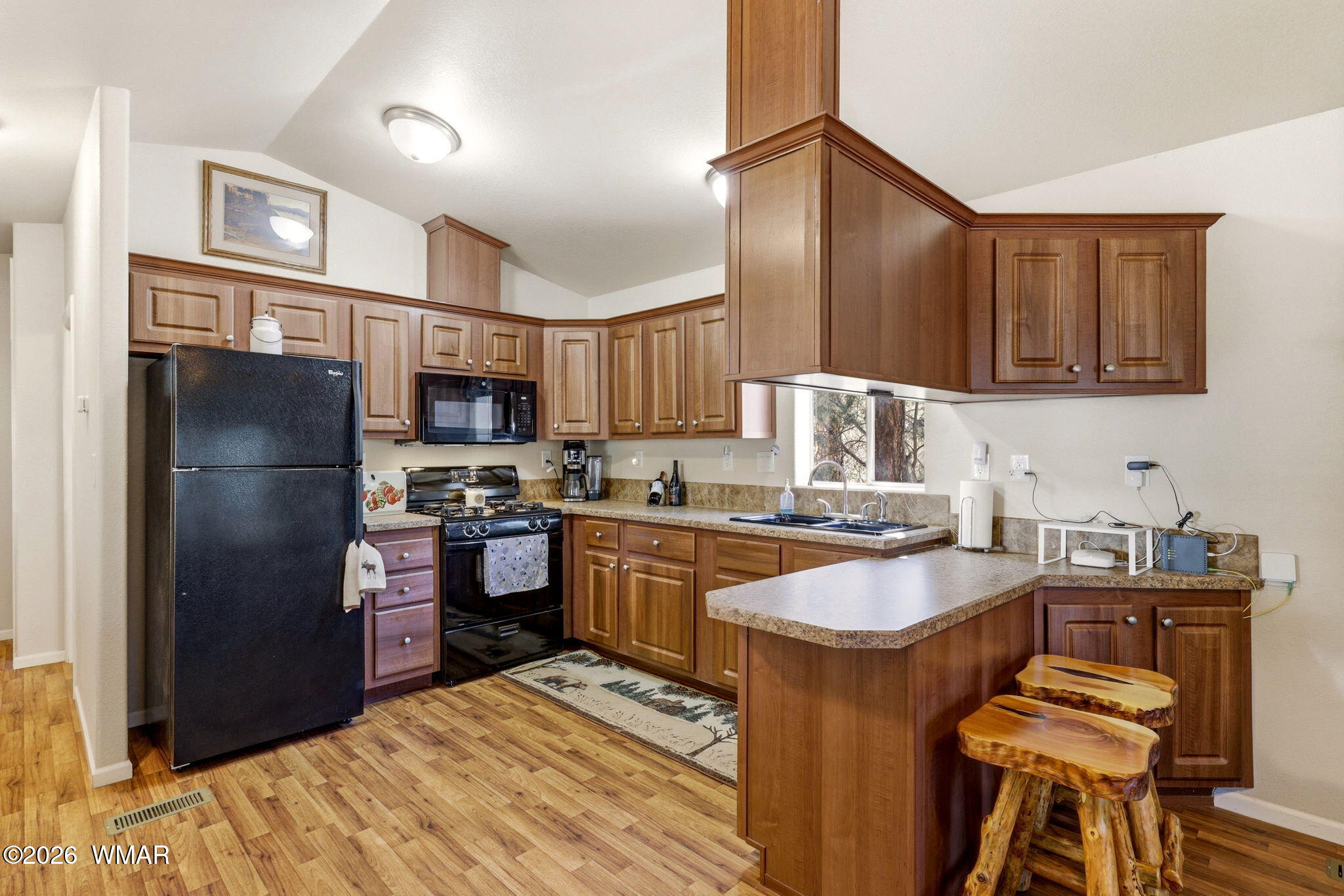 2893 Tracy Road Overgaard, AZ 85933 - Photo 10 of 26 a kitchen with granite countertop a refrigerator stove top oven and sink