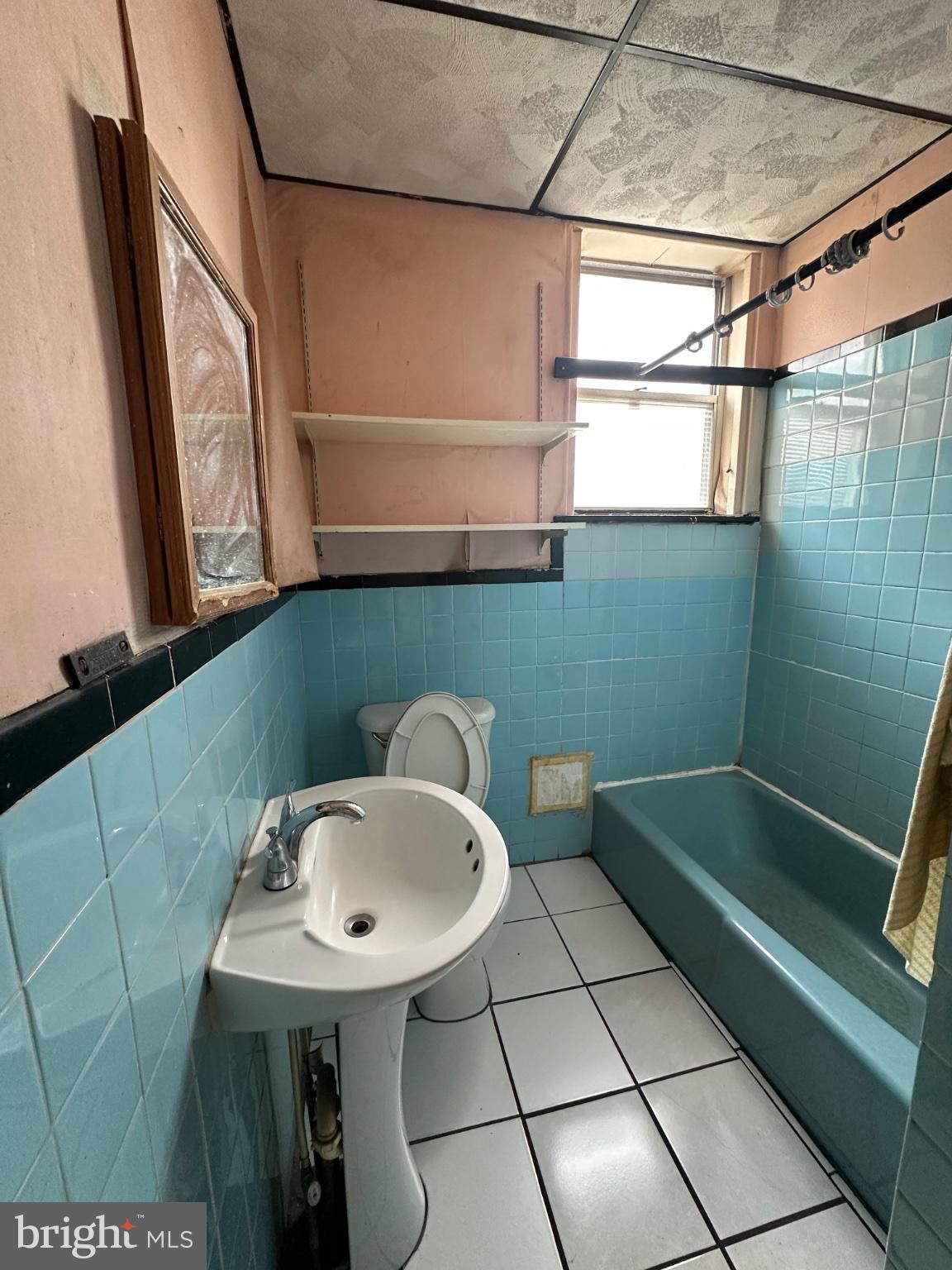 715 West Ritner Street Philadelphia, PA 19148 - Photo 13 of 19 a bathroom with a sink and a mirror