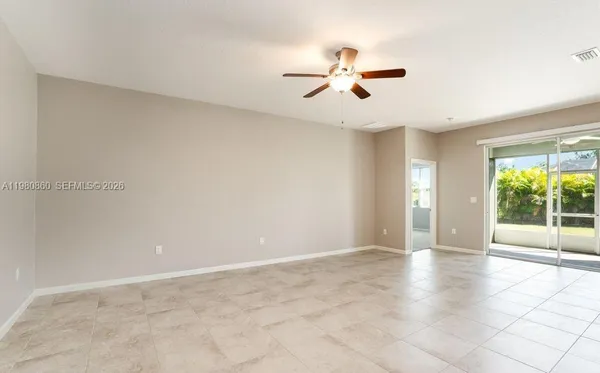 a view of an empty room with a window