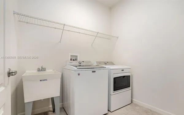 a utility room with dryer and washer