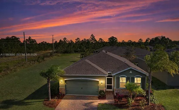 a aerial view of a house with a yard