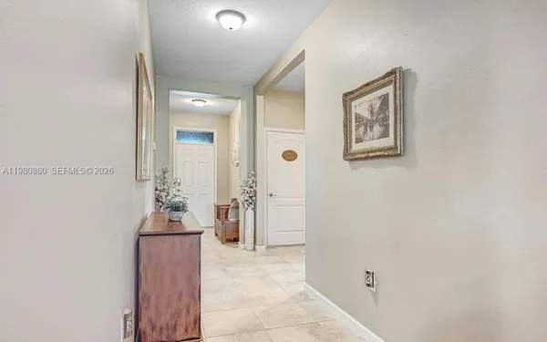 a view of a hallway with a flower pot