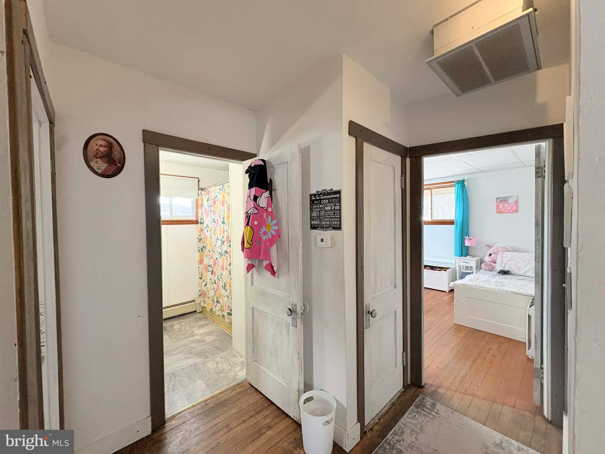 11825 Mason Road Northeast Cumberland, MD 21502 - Photo 16 of 26 Charming hallway connecting cozy rooms.