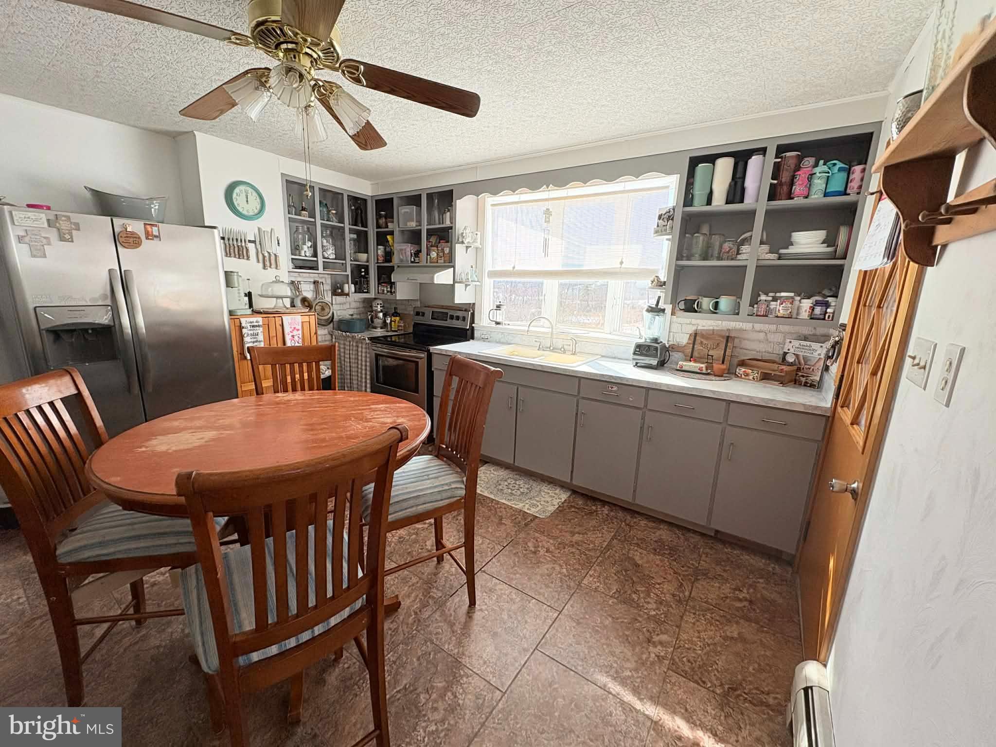 11825 Mason Road Northeast Cumberland, MD 21502 - Photo 7 of 26 Bright and inviting kitchen with cozy dining area.