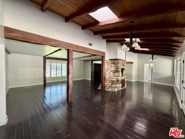 a view of a livingroom with wooden floor
