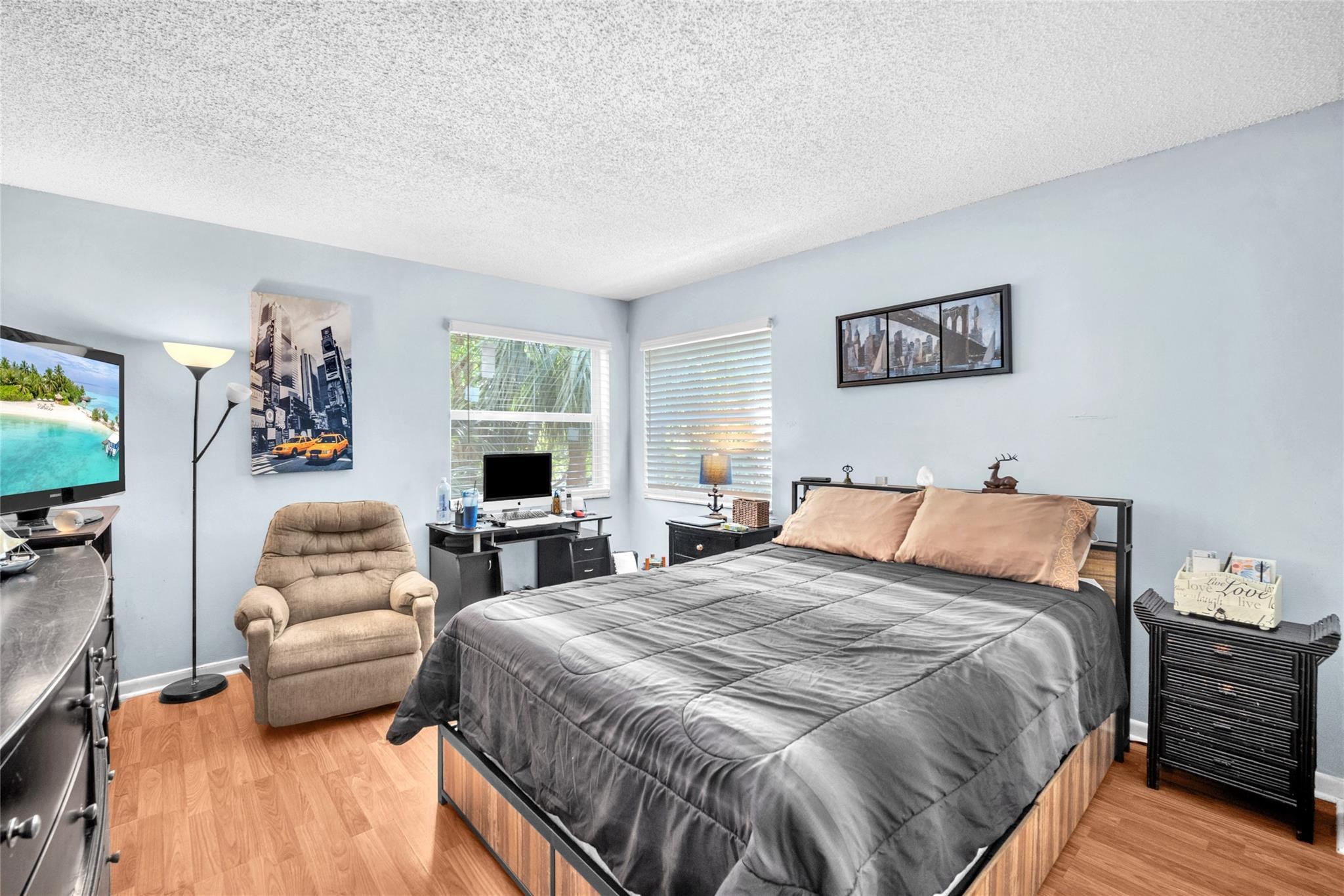 3910 Inverrary Boulevard, Unit 308B Lauderhill, FL 33319 - Photo 21 of 53 a bedroom with a bed and a couch