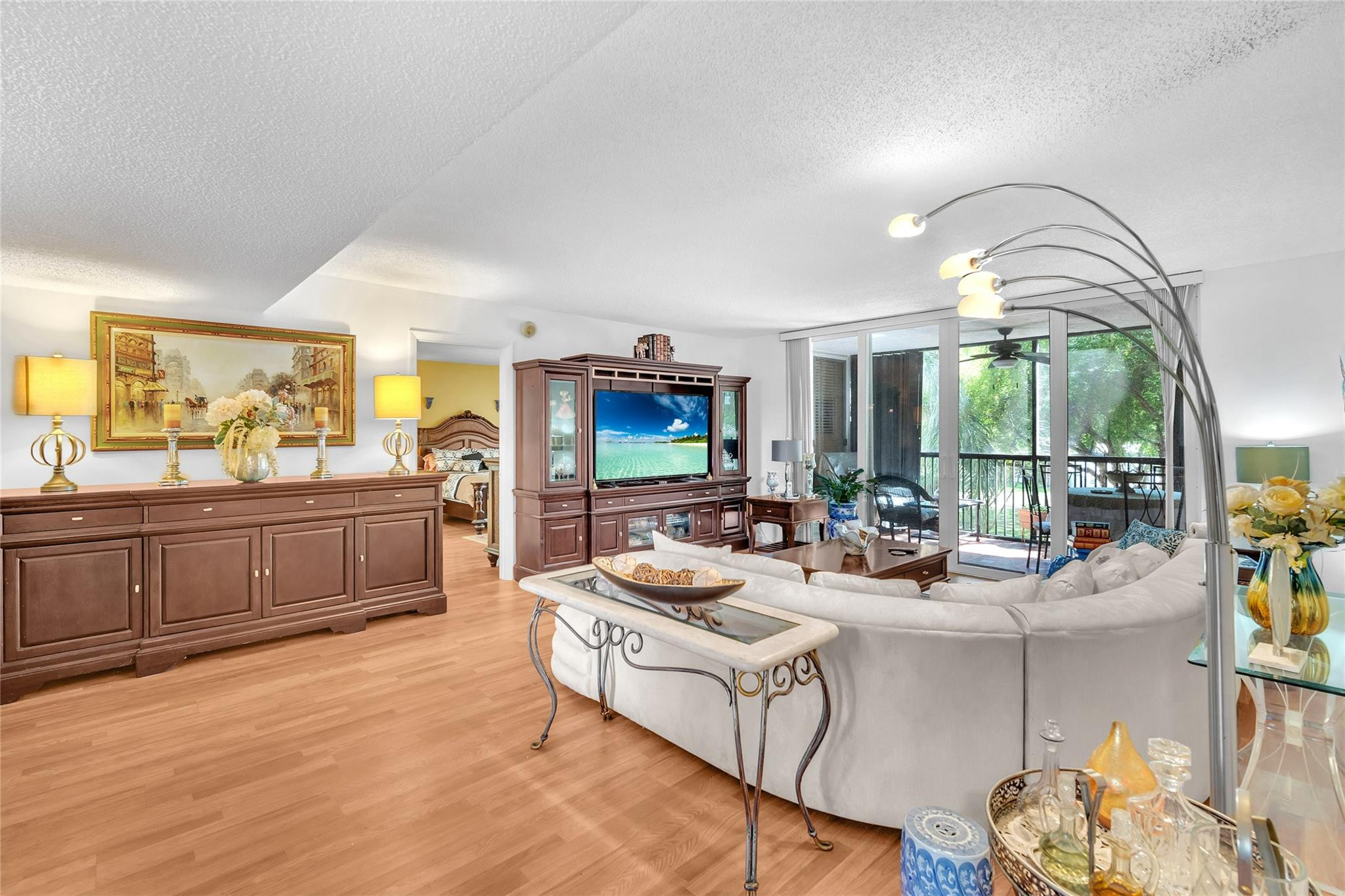 3910 Inverrary Boulevard, Unit 308B Lauderhill, FL 33319 - Photo 3 of 53 a living room with furniture fireplace and a large window