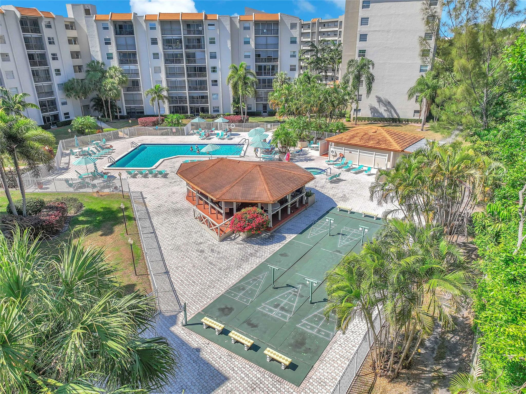 3910 Inverrary Boulevard, Unit 308B Lauderhill, FL 33319 - Photo 36 of 53 a view of a swimming pool with a lounge chairs