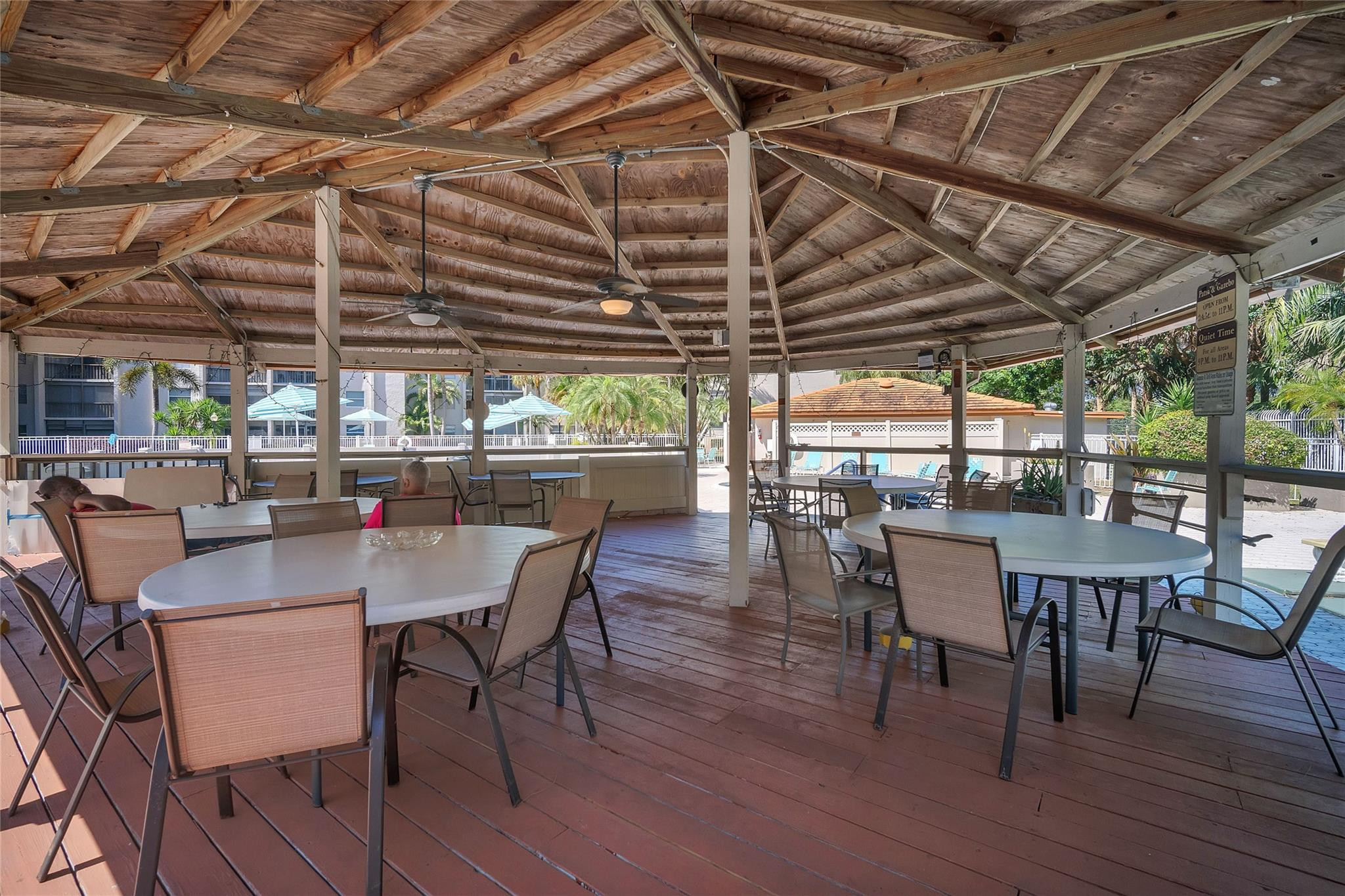 3910 Inverrary Boulevard, Unit 308B Lauderhill, FL 33319 - Photo 39 of 53 a dining room with a wooden table and chairs