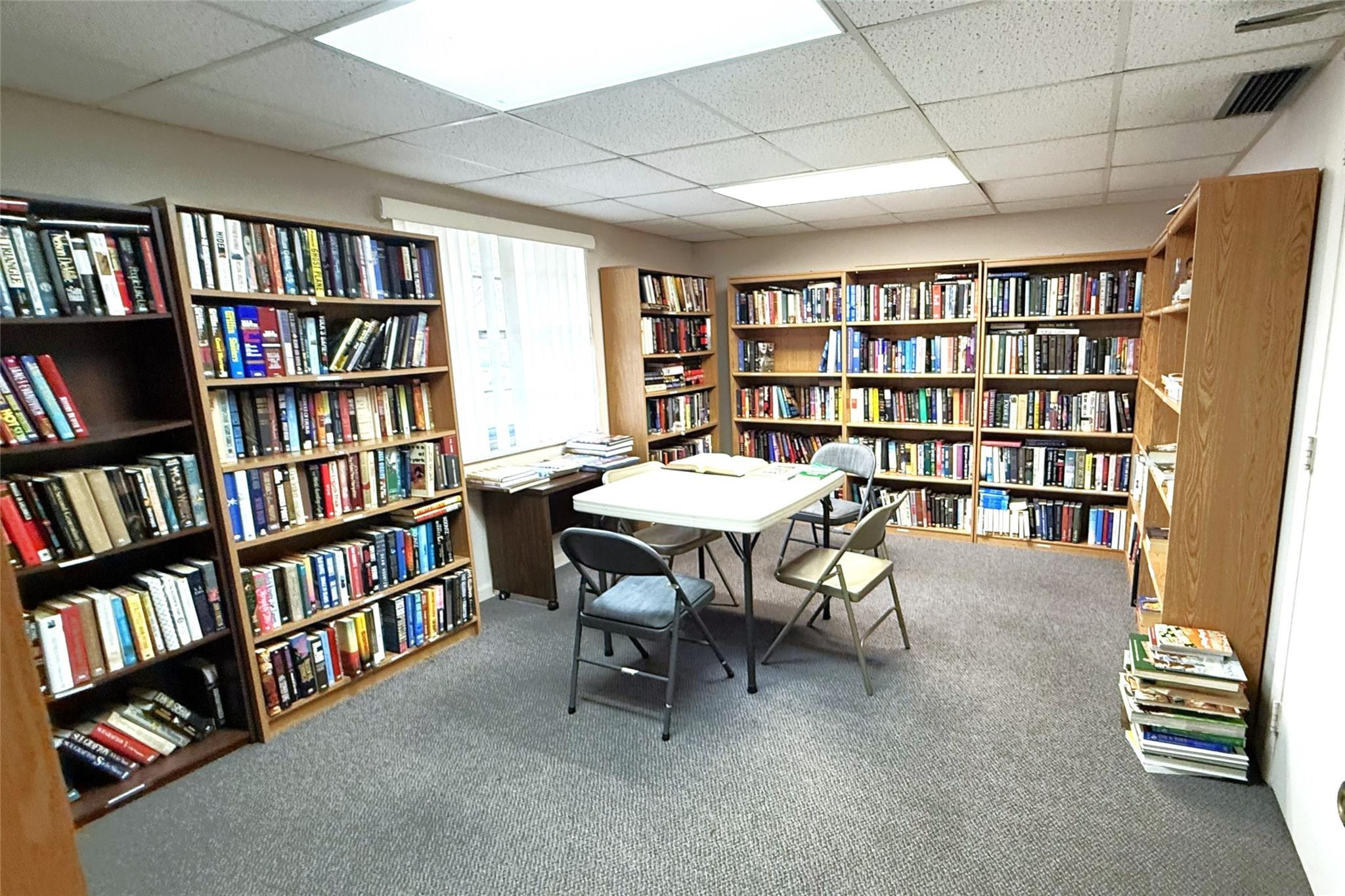 3910 Inverrary Boulevard, Unit 308B Lauderhill, FL 33319 - Photo 50 of 53 a view of a workspace with furniture and a bookshelf