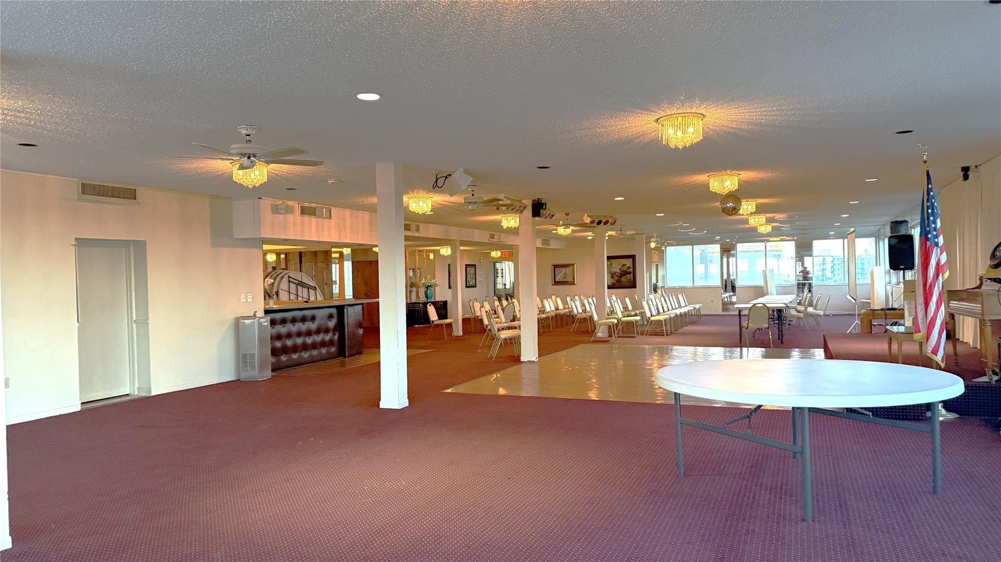 3910 Inverrary Boulevard, Unit 308B Lauderhill, FL 33319 - Photo 51 of 53 a dining room with furniture and a kitchen view