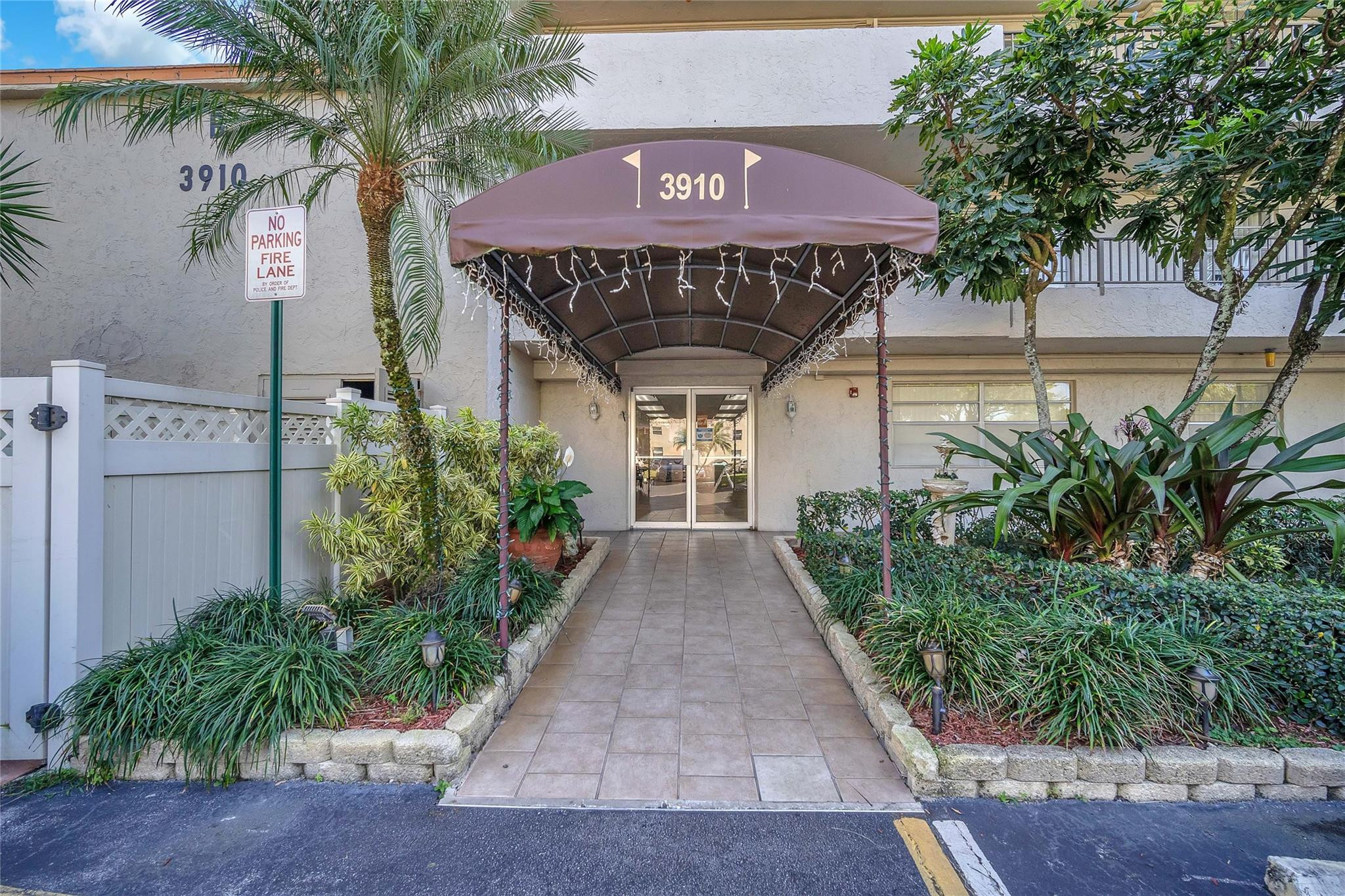 3910 Inverrary Boulevard, Unit 308B Lauderhill, FL 33319 - Photo 10 of 53 a front view of a house with garden