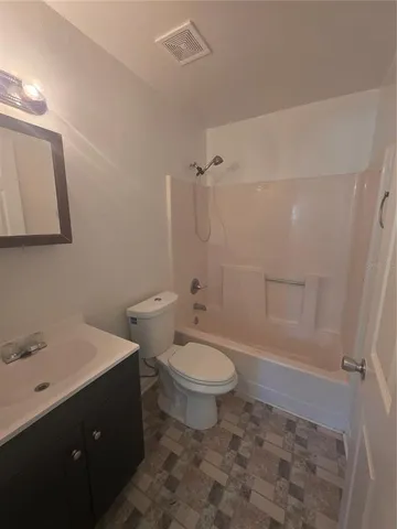 a view of a big room with windows