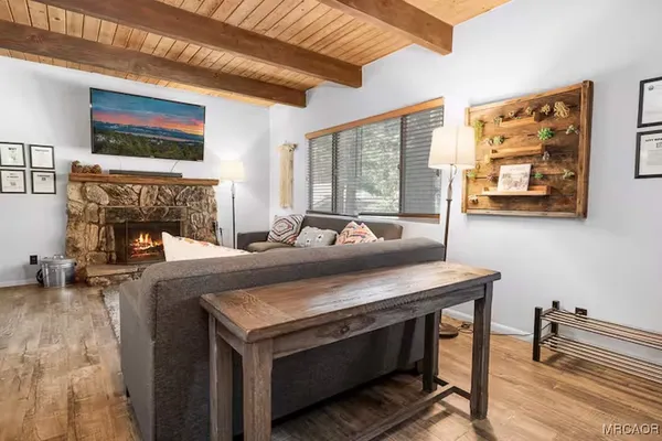 a view of a kitchen with a sink and a fireplace