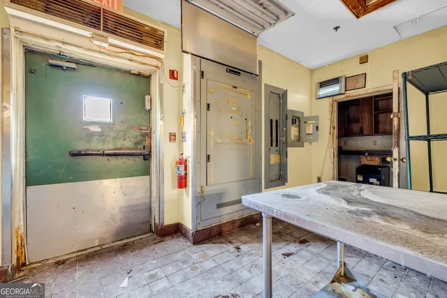 a living room with furniture a table and chairs