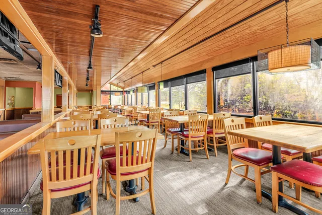 a kitchen with stainless steel appliances a stove and a sink
