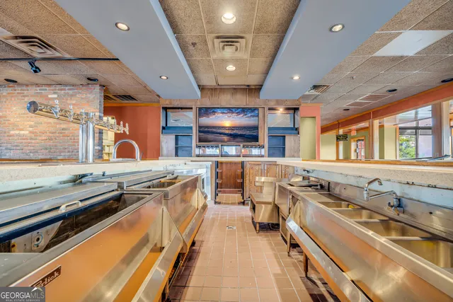 a view of a kitchen with furniture and a kitchen