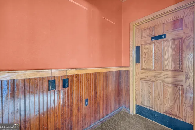 a kitchen with stove and cabinets