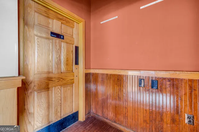 a view of a kitchen with a sink and cabinets