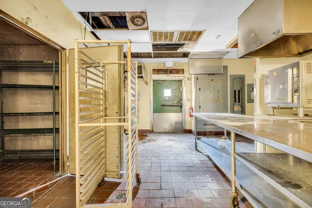 a view of a building with a yard