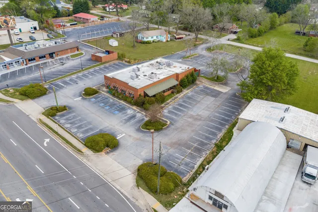 a view of a dining hall with many windows