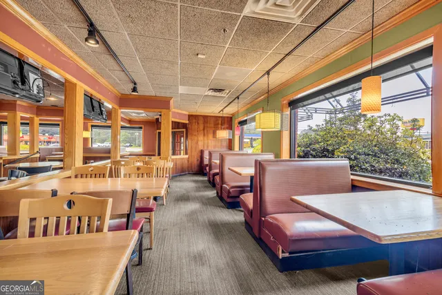 an aerial view of residential house with parking