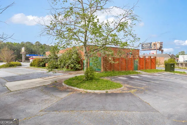 a view of a park with large trees
