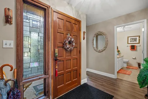 a living room with furniture a rug and a chandelier