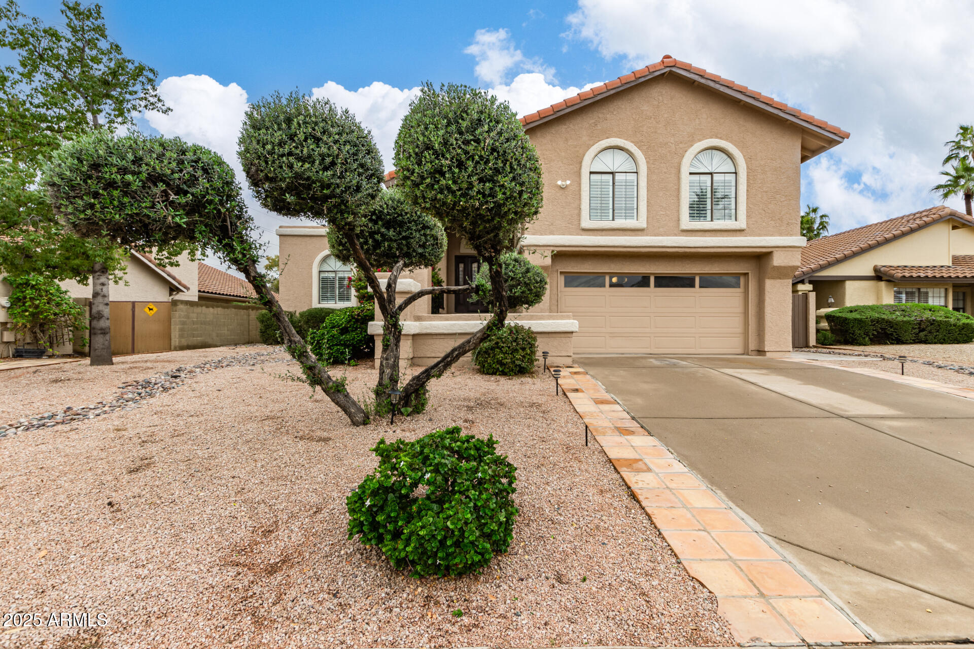 13042 South 42nd Street Phoenix, AZ 85044 - Photo 1 of 39 a front view of a house with a yard and garage