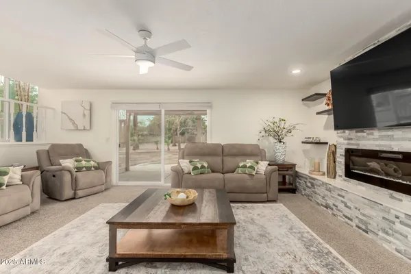 a living room with furniture and a flat screen tv