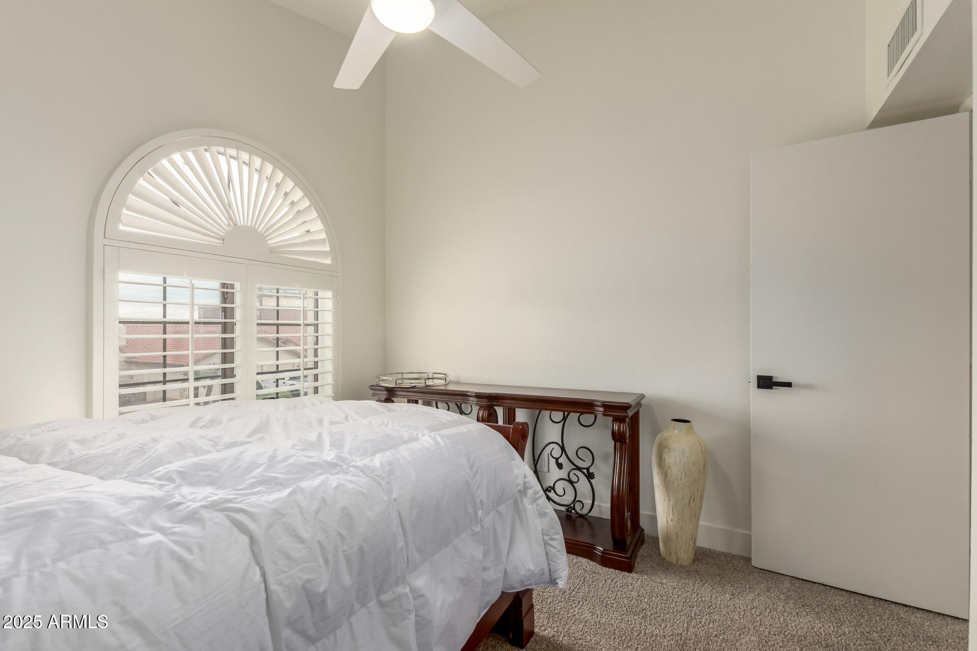 13042 South 42nd Street Phoenix, AZ 85044 - Photo 19 of 39 a bed room with a bed and a large window
