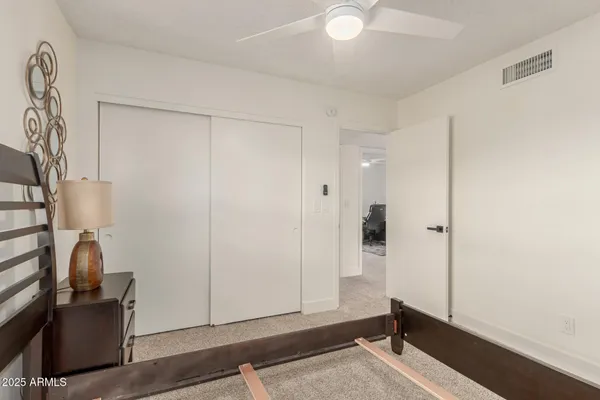 a bathroom with a sink toilet and a mirror
